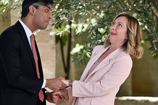 The British prime minister greeting the Italian prime minister at the 50th G7 summit