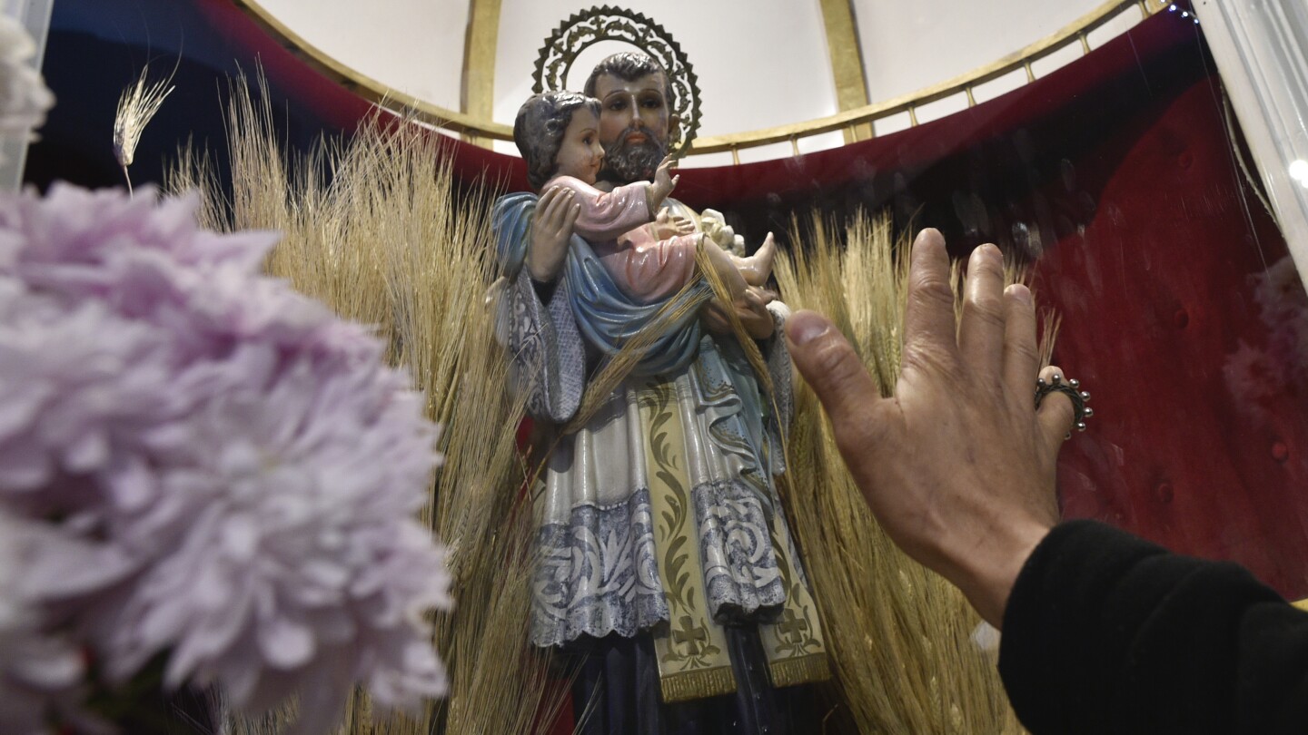 As President Milei’s austerity hits hard, jobless Argentines appeal to the patron saint of work