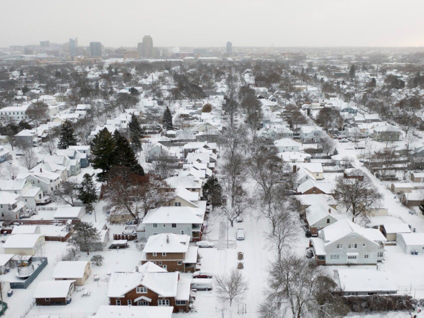 A storm brings squalls to the Northeast; 2 people die from heart attacks after shoveling snow